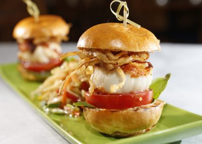Scallop sliders with fried onions.