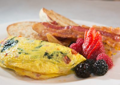Omelet, bacon, berries.