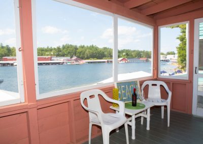 Cottage Two enclosed patio with patio chairs.
