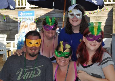 friends with Mardi Gras masks.