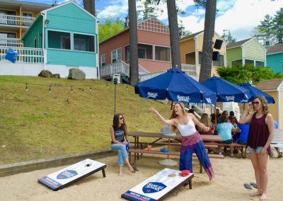 Guests tossing bags on the beach.