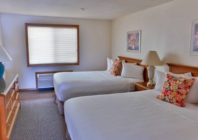 Guest room with two queen beds.