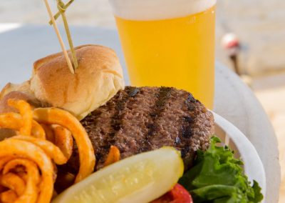 Hamburger, onion rings, and a beer.