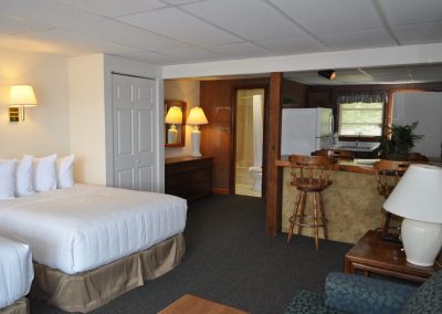 Studio suite with two queen beds, kitchen and breakfast bar.