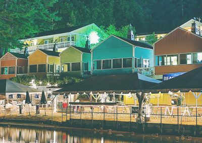 The NASWA Resort, beach and Lake Winnipesaukee at night.