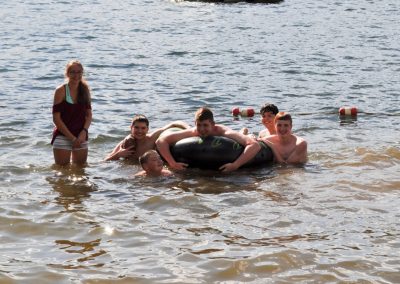 Kids playing in the lake.