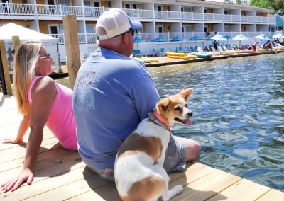 Couple and dog on the docks.