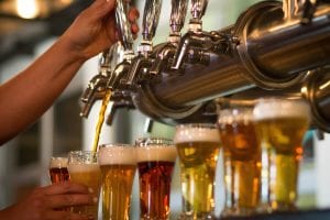 A flight of beer mugs filled up at one of many New Hampshire breweries.